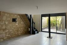 Salon séjour mur en pierre